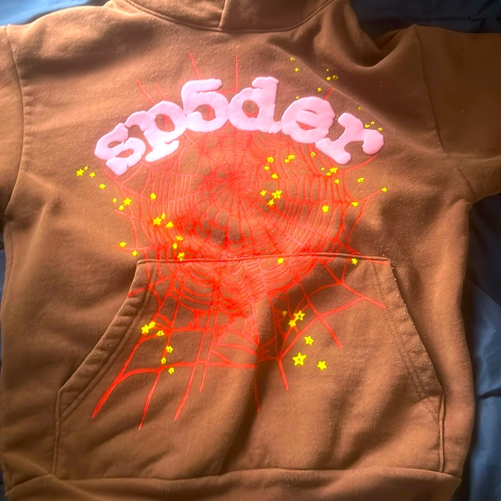 Selling a brown red and pink sp5der hoodie.